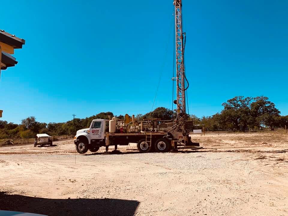 This is the huge truck to dig the well that was left on our property. It has two very high flags flying on it, which I love-the Texas Flag and the USA Flag!