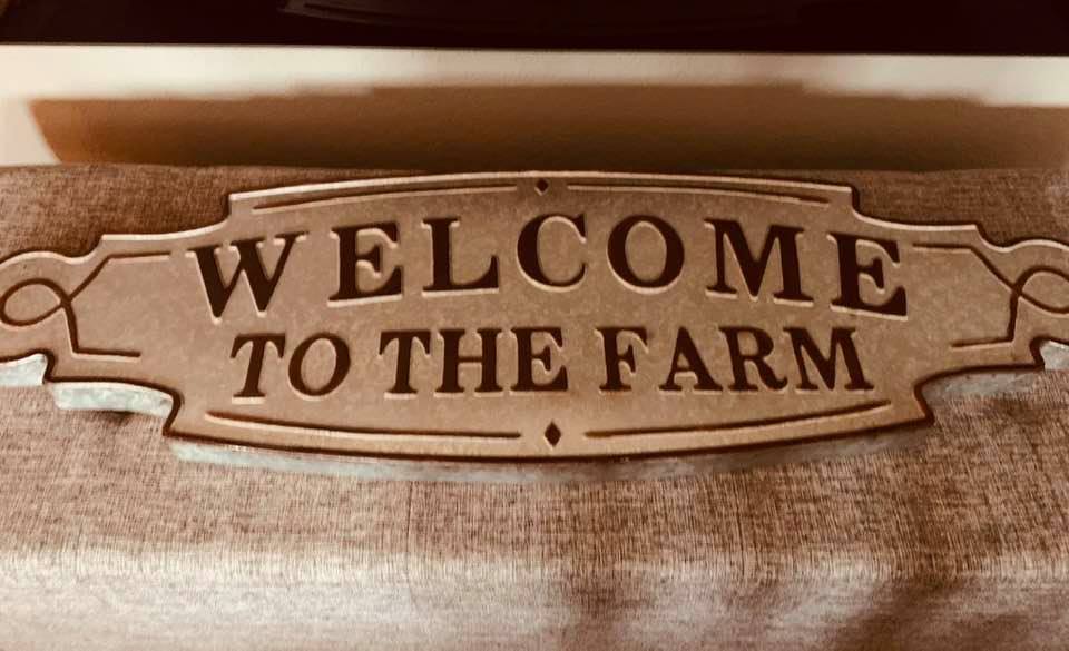 Ruth Anne and Clyde brought us a beautiful Christmas gift, a Welcome To The Farm sign to hang over the mantel.