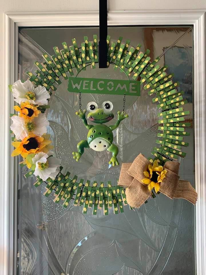 Adorable clothespin frog wreath on my front door that my friend, Carolyn, made me.
