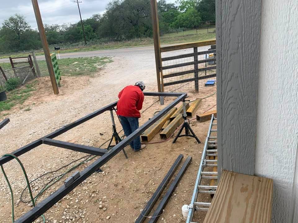 Welder building our front gate.