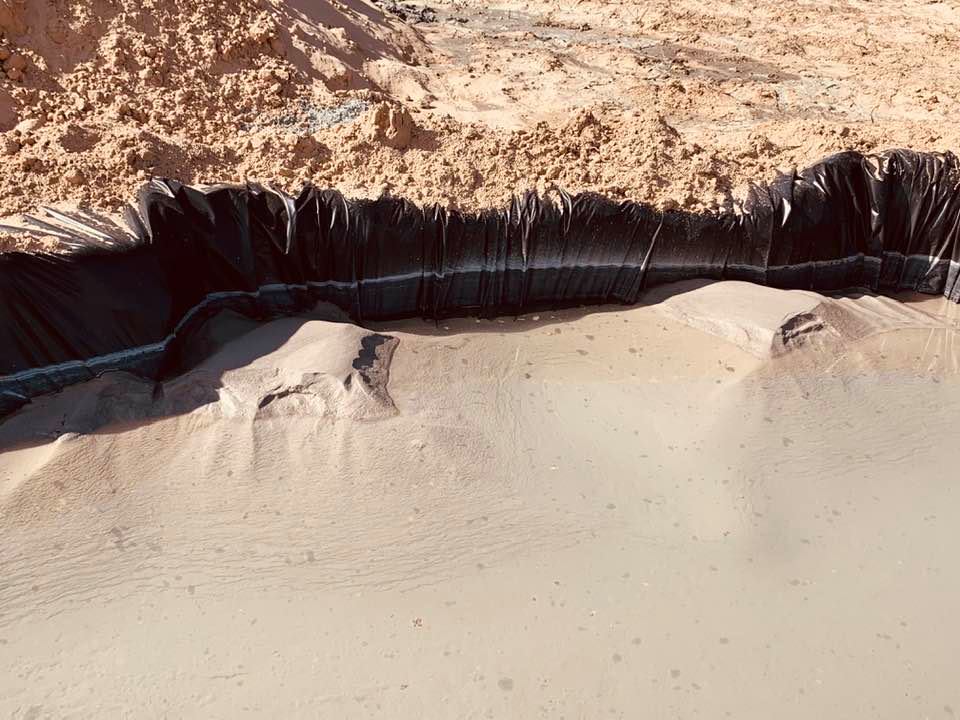 Pit filled with water and sand from up to 
380 feet below the ground in our front yard.