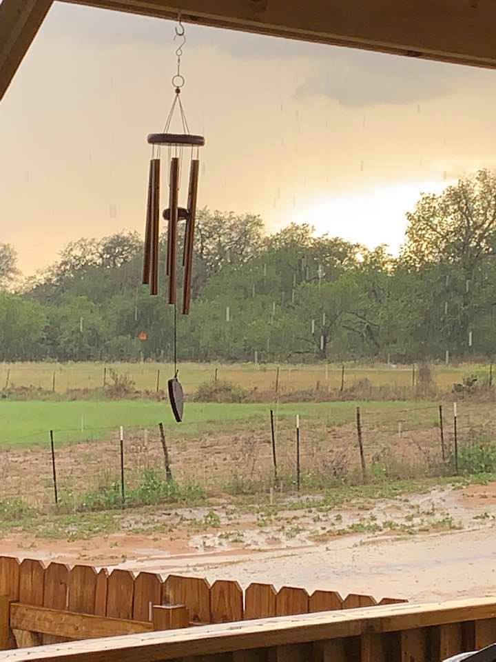 Right at sunset, a thunderstorm started. It caught me out with my chickens. I was trying to get them in for the night so they wouldn't get wet. I ran back to the house and took this photo.