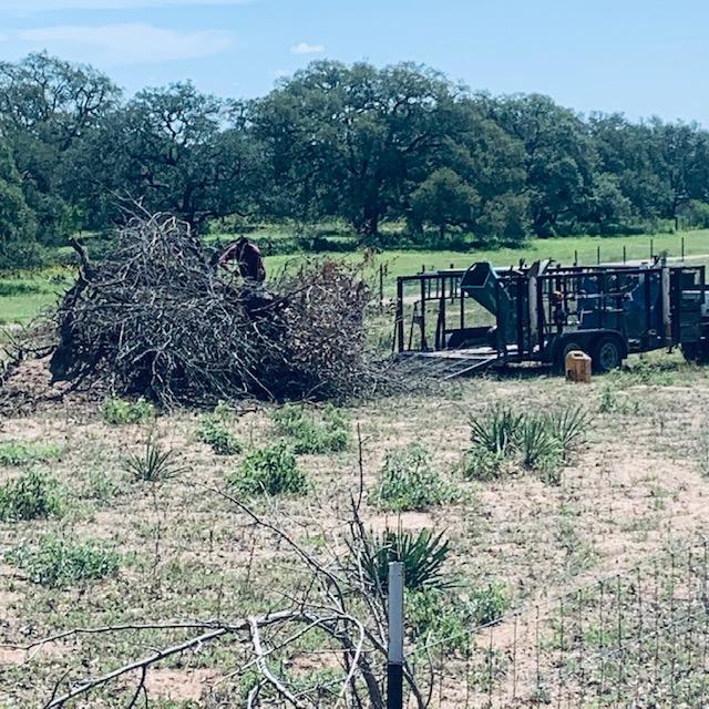 Our neighbors had a large wood pile so Nacho and his crew are chipping it so we can use it for mulch.