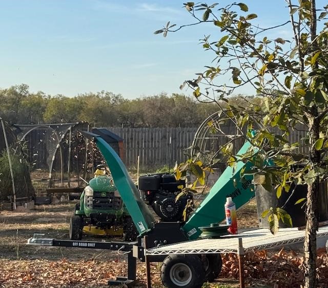 The wood chipper turns branches into mulch and with gardens as big as we have, we need plenty of mulch.