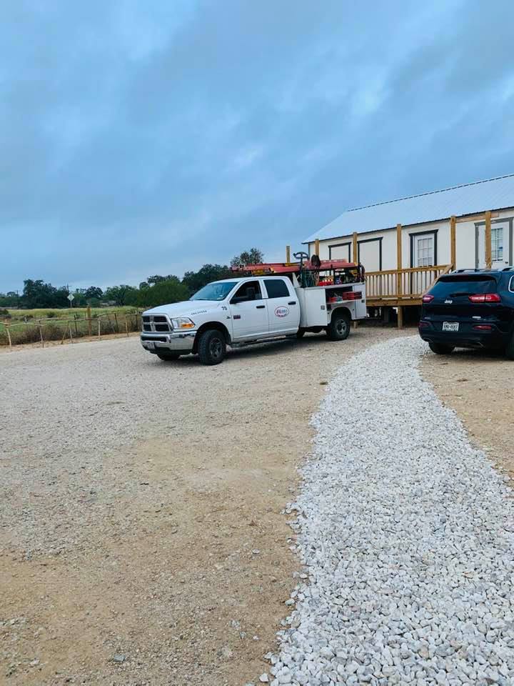 One of the contractors is here early. You can see the stone walking path so we don't get muddy when it rains.